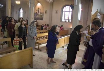 Palestinian Christians receiving communion