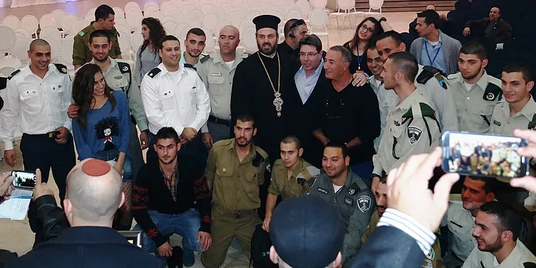 Father Gabriel Naddaf with Deputy Minister Ofir Akunis and Christian IDF soldiers, December 14, 2014 Father Gabriel Naddaf with Deputy Minister Ofir Akunis and Christian IDF soldiers, December 14, 2014